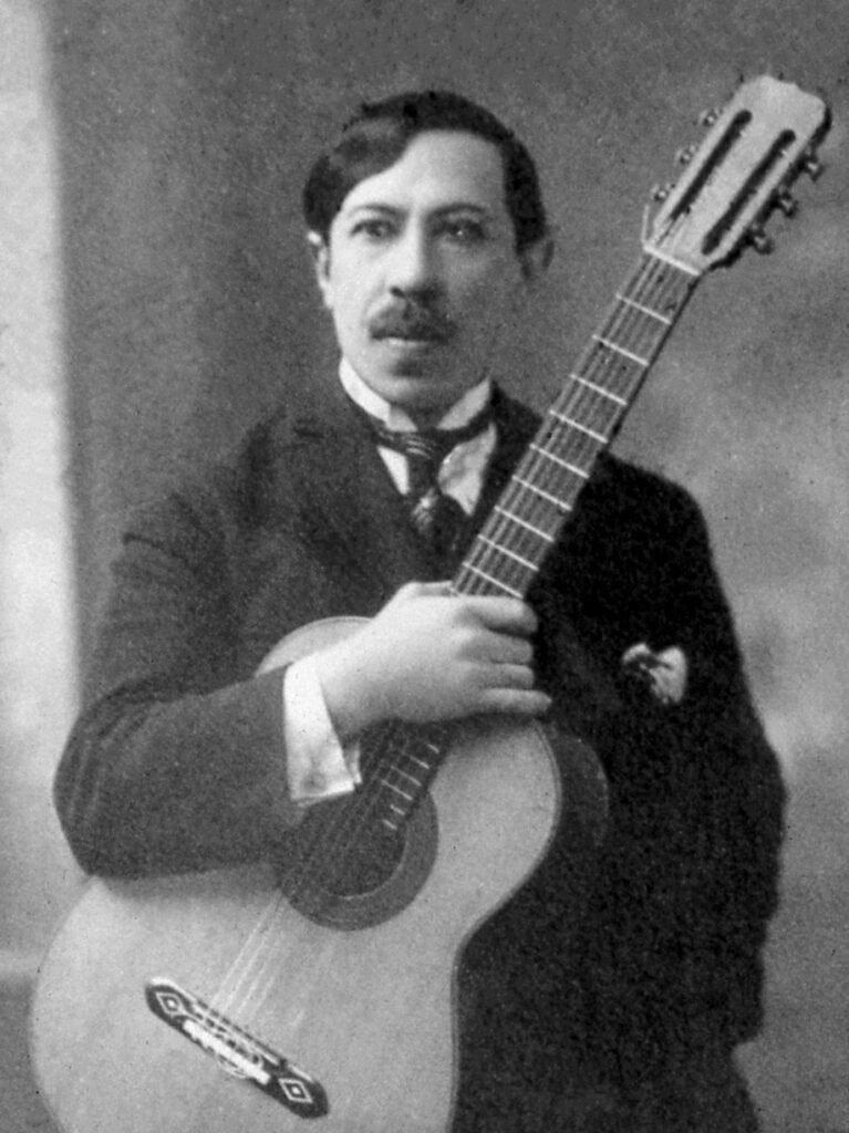 Portrait of guitarist and composer Agustín Barrios Mangoré with guitar, 1922